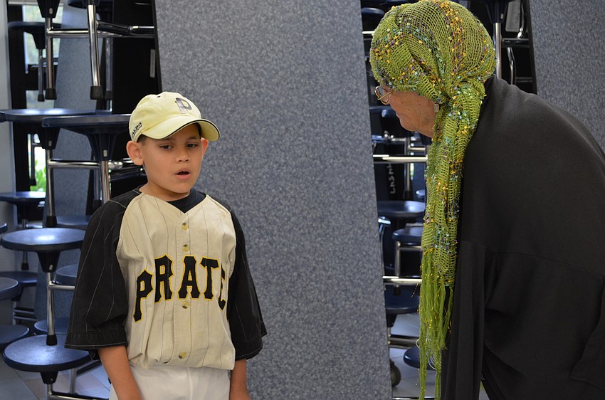 Sebastian Rosa explains Roberto Clemente to Celia Nachlas.