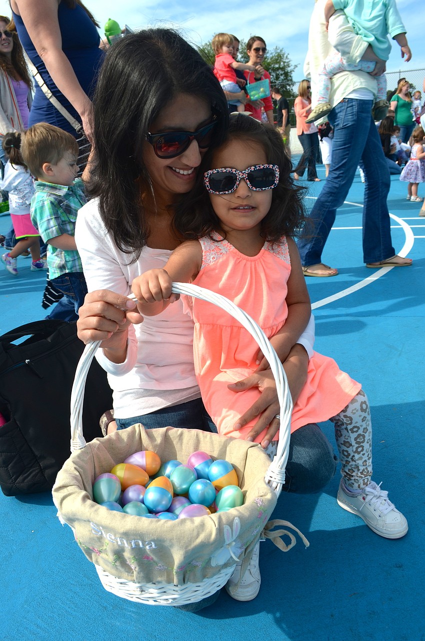 Deepa Alfano and her daughter, Sienna, enjoy their first egg hunt at Greenbrook Adventure Park.
