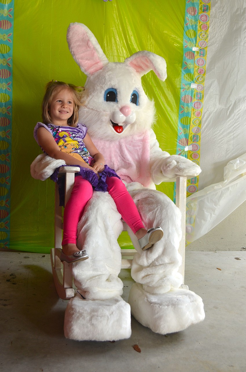 Natalie Meabon, 4, was one of the first children to pose with the Easter Bunny.