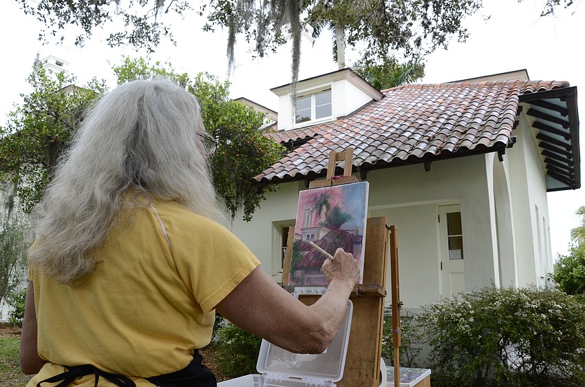 Judy Klein, a Sarasota resident and four-year member of the Light Chasers, paints a colorful picture of the Mansion .