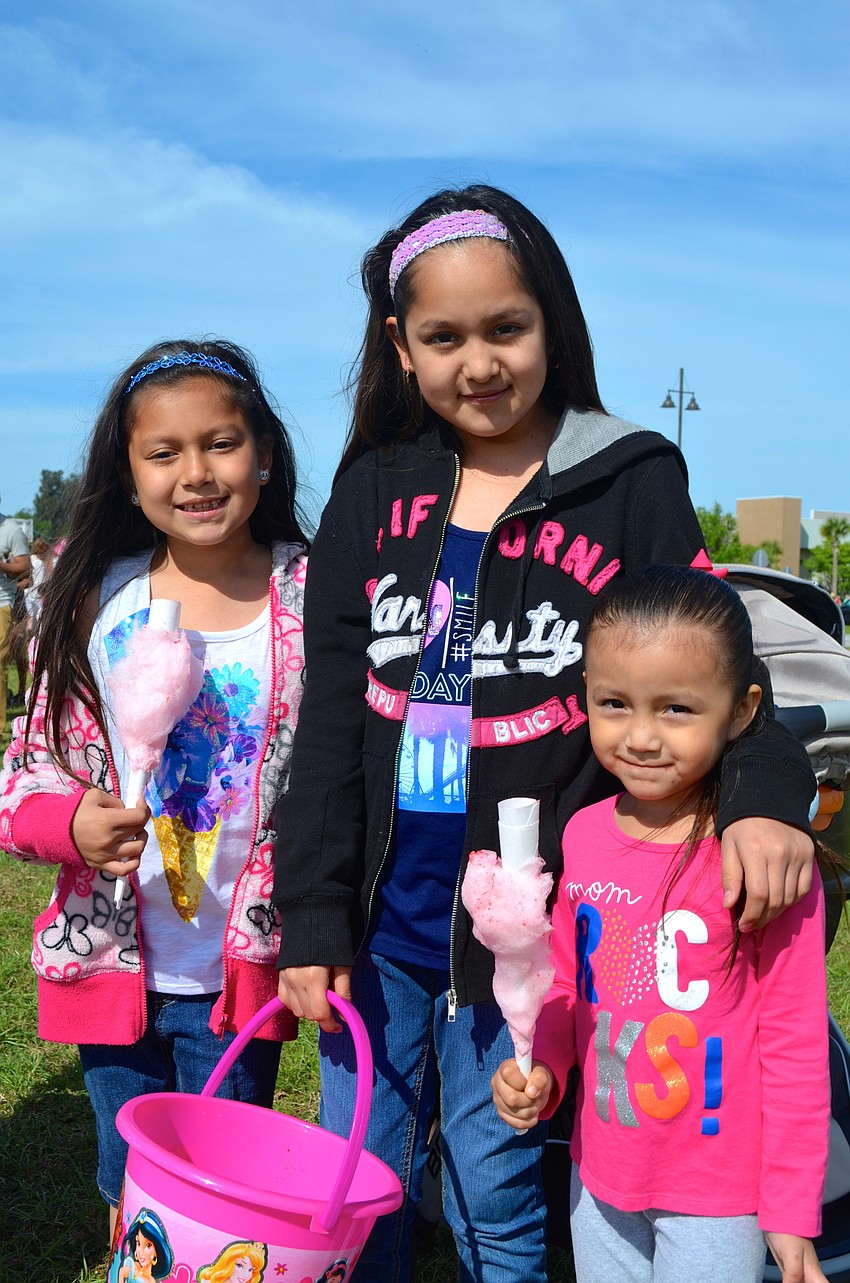 Elyan and Eleny Hernandez wait for the Easter egg hunt to start, alongside Adelyn Martinez.