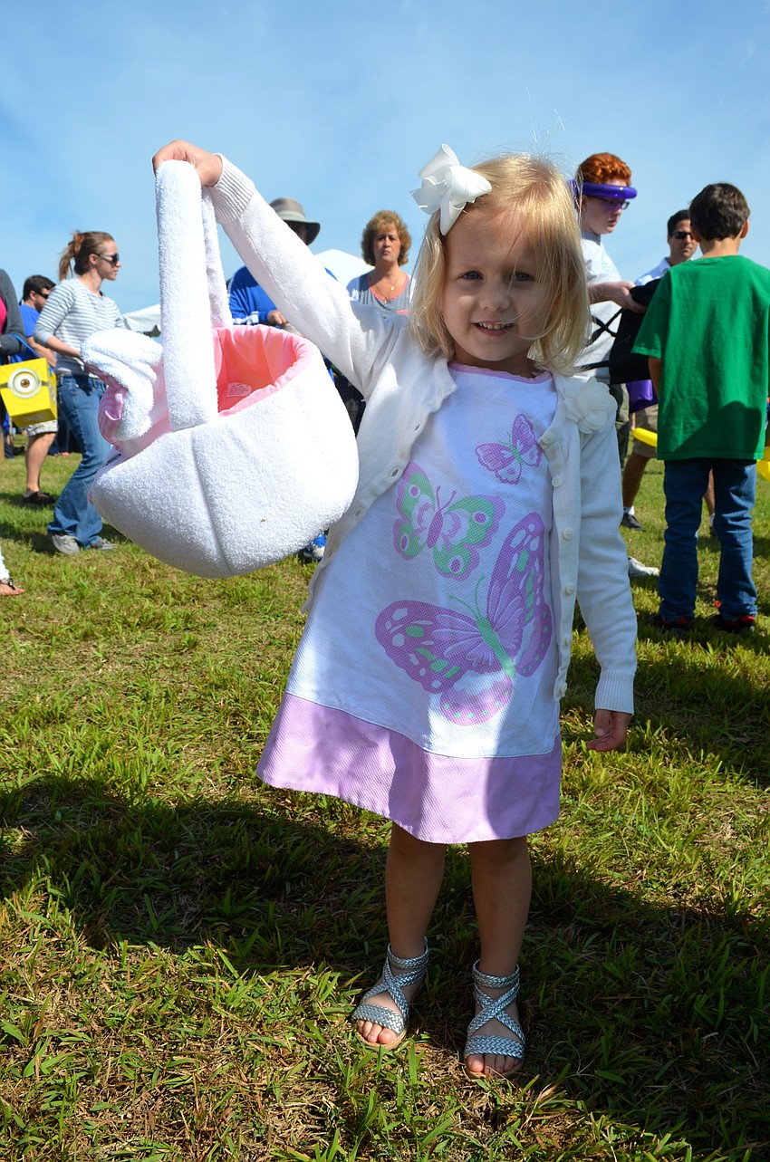 Ella Wiegman, 3, is anxious to fill up her Easter bunny basket with eggs.