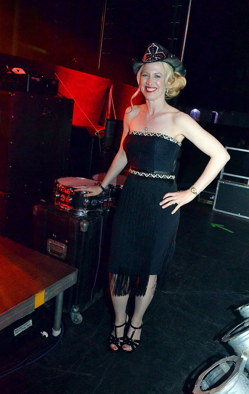 Firefly Gala Chairwoman Ariane Dart on stage before the Bret Michaels concert