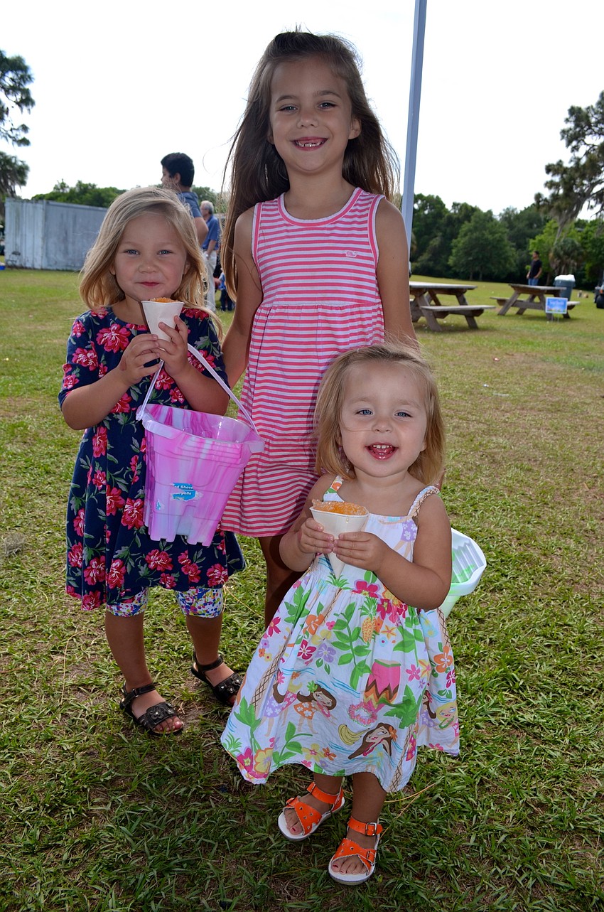 The Davis sisters — autumn, Alex and Avery — agree to disagree on who collected the most candy.