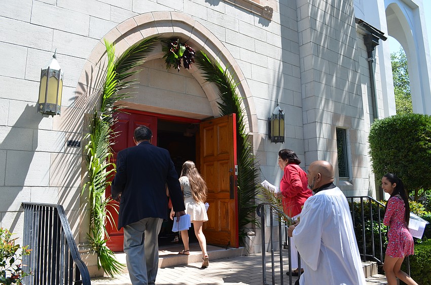 The doorway to the chapel was decorated with palm fronds to commemorate Palm Sunday at Church of the Redeemer.