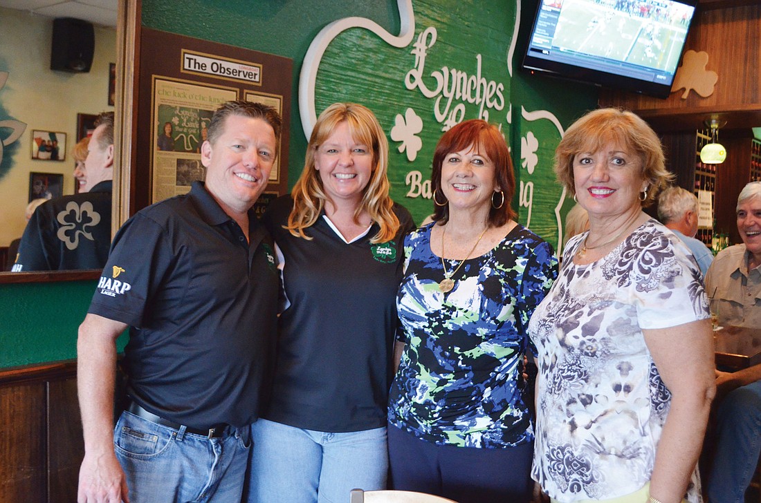 New Lynches Pub & Grub owners Jason and Lisa Burns with longtime owners Ethna and Chris Lynch, who opened Lynches Landing on Longboat Key in 1986, and then closed the restaurant to open Lynches Pub & Grub on St. Armands Circle.