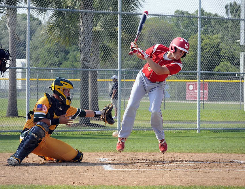 Cardinal Mooney pitcher Josh Bonynge is hit by a pitch during the Cougars game versus Killian March 26.
