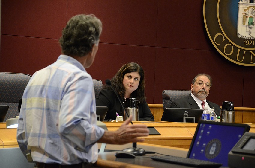 Bill Zoller, president of Control Growth Now, addresses Commissioner Christine Robinson during the open to the public section.