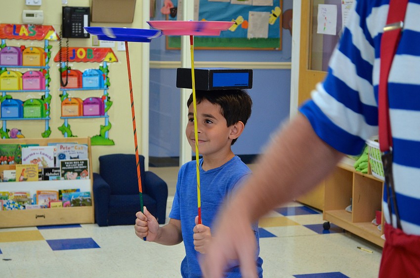 Gabriel Cevas learns to balance multiple objects at once.