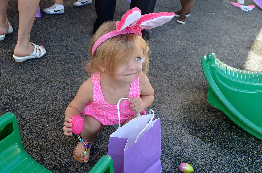 Parker Thomas shows her mother the eggs she collected so far.