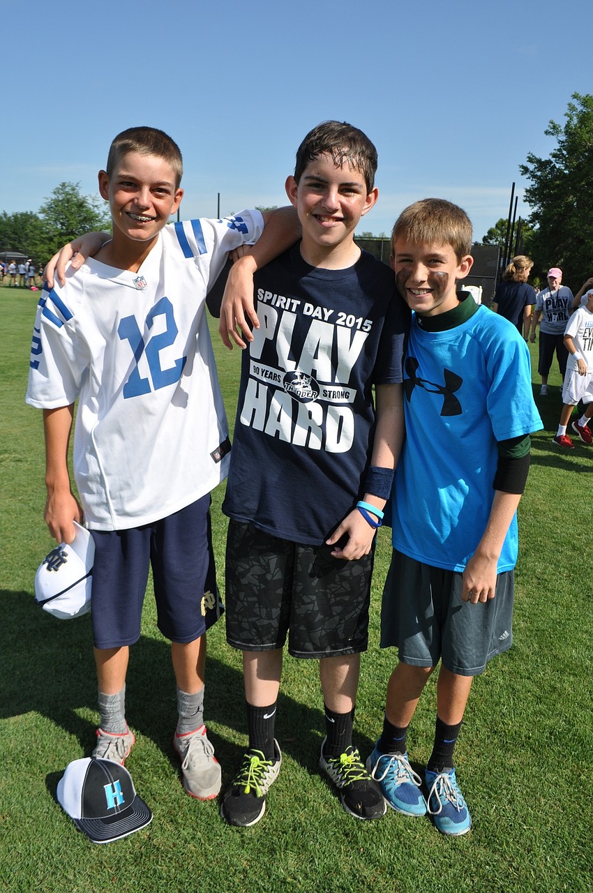 Connor Krug, Hugh Schimberg and Hayden Coakley are all smiles after finishing the minefield game.