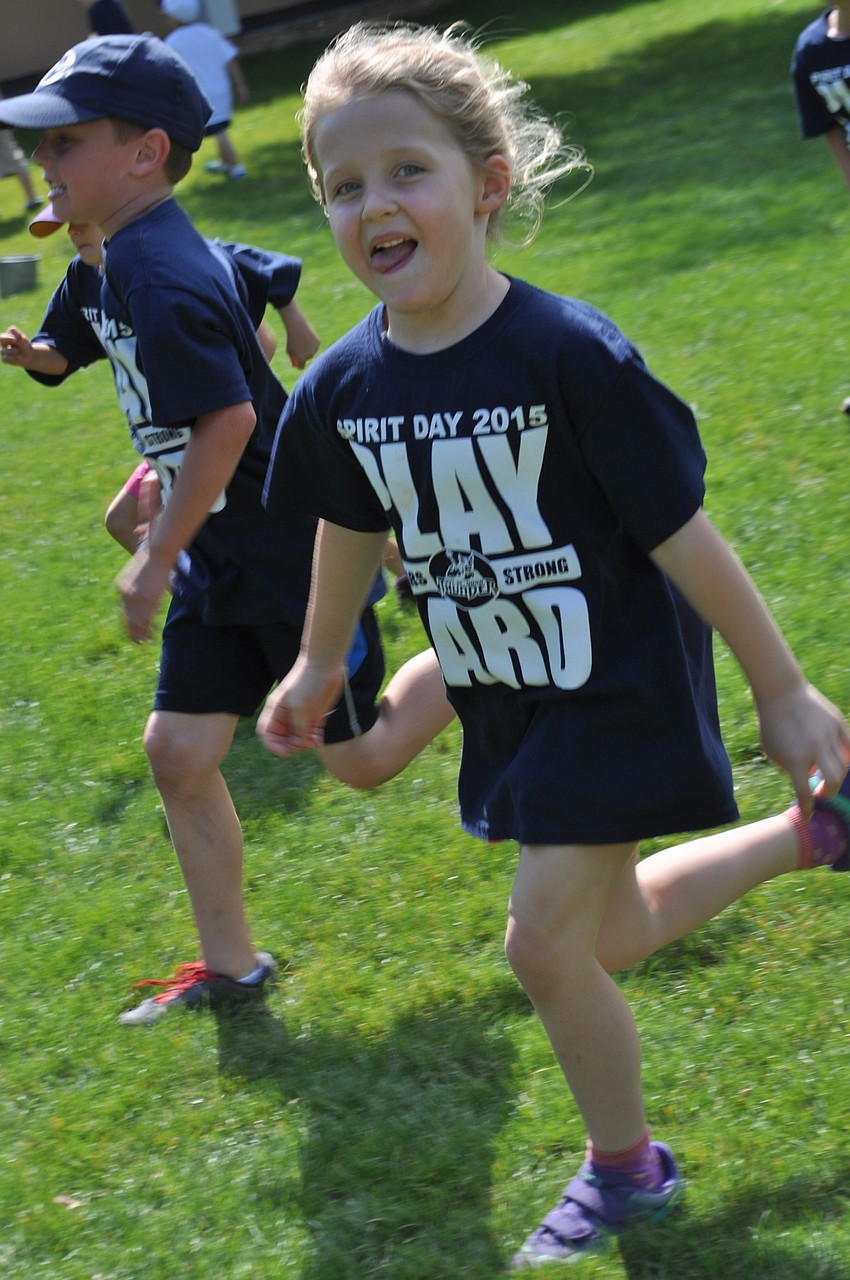 Alea, 5, runs across the courtyard area.