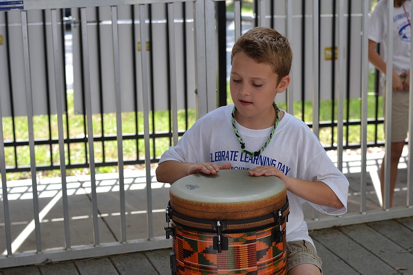 Wesley Freeman plays a drum in Africa.