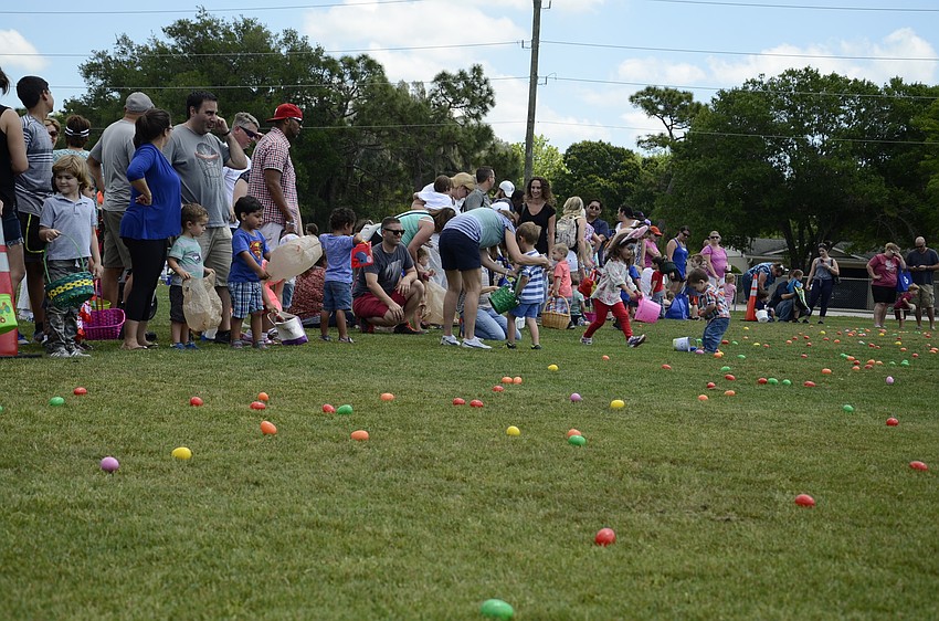 Parents and kids line up for the Easter egg hunt.