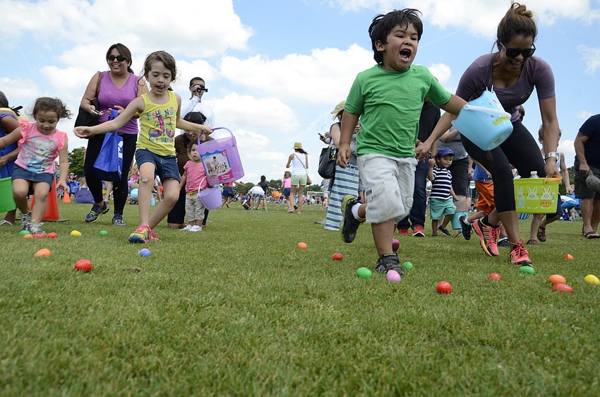 After an agonizing wait, kids at the Big Truck EGGstravaganza egg hunt were released onto the field.