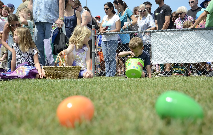 Kids wait to get the eggs. Waiting is hard!