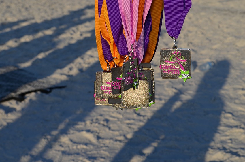 Members of the Girls on the Run team received personalized medals.