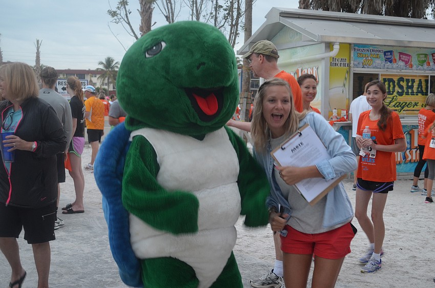 Krystal Lyons has fun with Shelly the turtle.