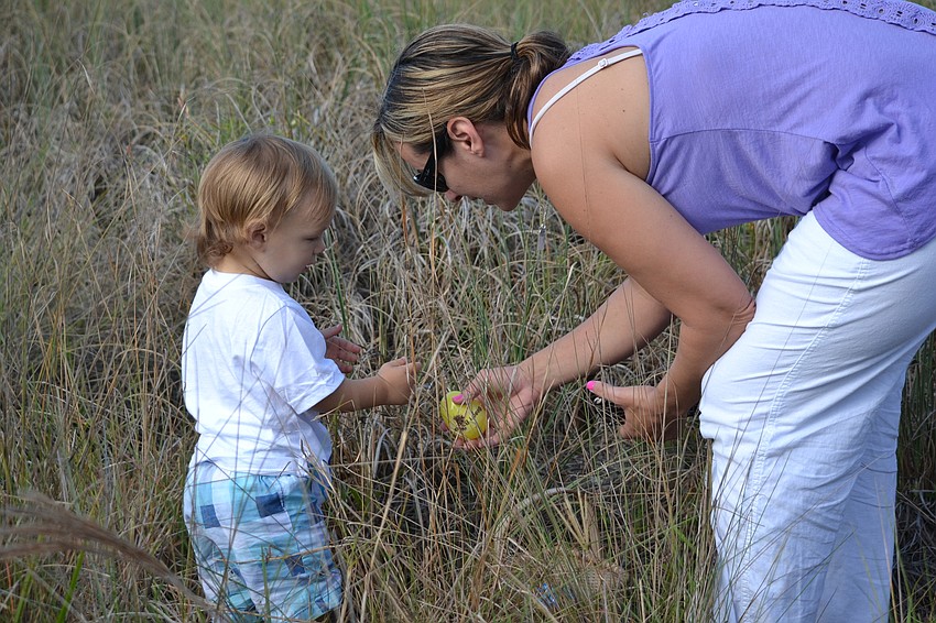 Oliver and Holly Loftus search for eggs.
