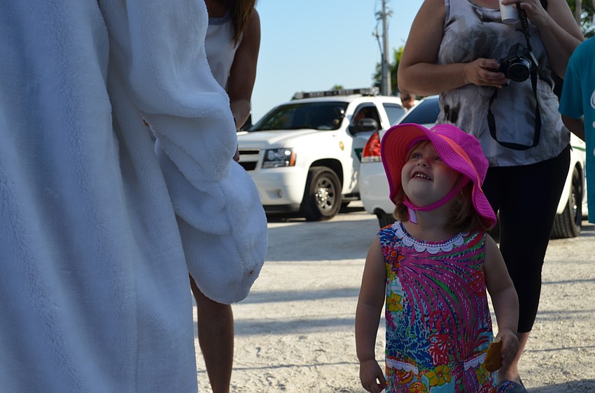 Olivia Rowley catches a glimpse of the Easter bunny.