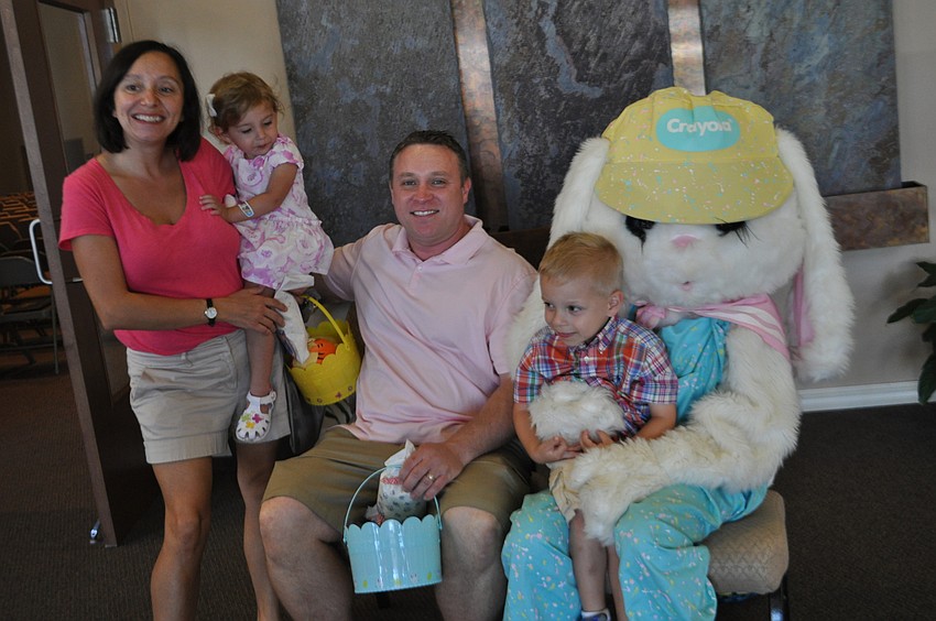 Colleen, Caroline, James and James Heim pose with the Easter Bunny.