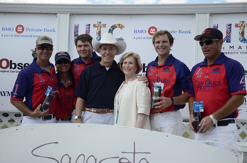 Matt and Lisa Walsh with the winning team, Twin Oaks. Observer Media Group was the match's media sponsor.