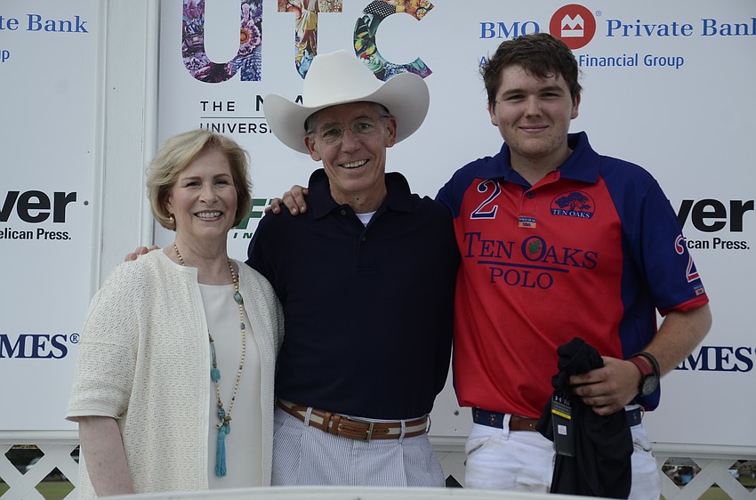 Lisa and Matt Walsh with Jon Luke Beck, the most valued player of the match.