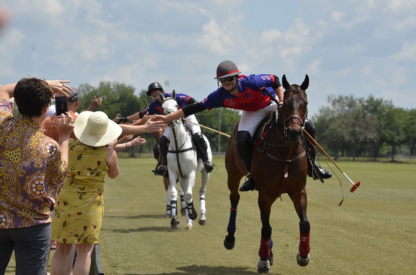 Twin Oaks rider Jon Luke Beck gets support from the crowd at the match parade.