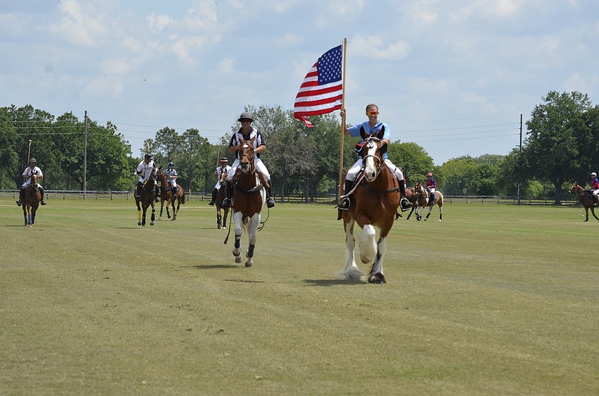Both teams paraded the field before the match Sunday.