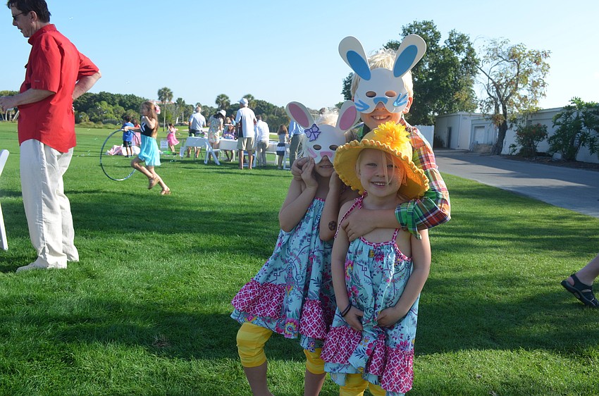 Lilly and Madison Harris, 5, with brother, Hunter, 7