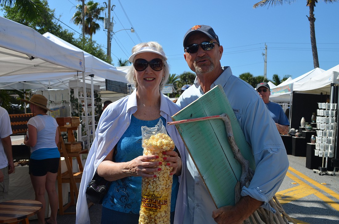 Siblings Vergene Mayne and Mike Thayer take in the Siesta Fiesta art and craft festival.