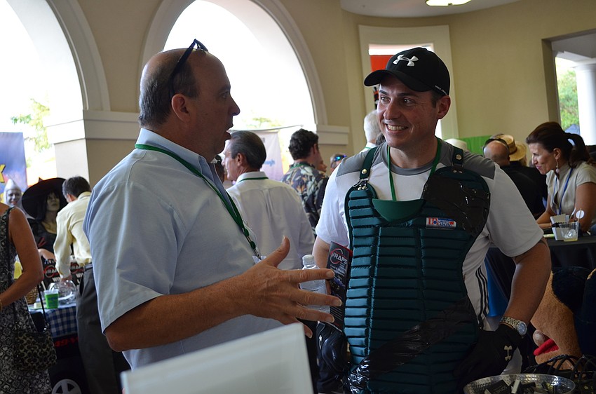 Mark Resnick from Sophie’s at Saks Fifth Avenue listens to Al Benincasa.