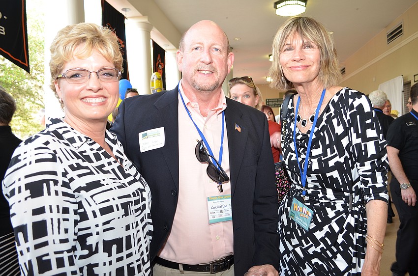 Kim and John Lege, with Commissioner Suzanne Atwell