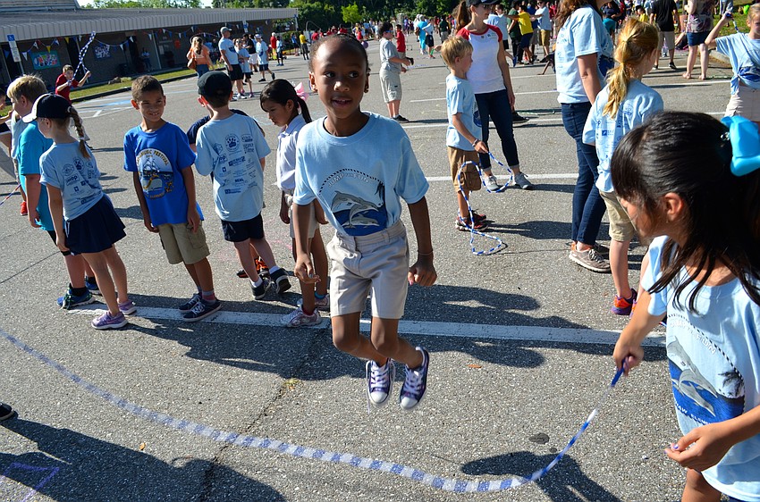 Eight-year-old Meagan Butler poses while her friends whip around the jump rope.