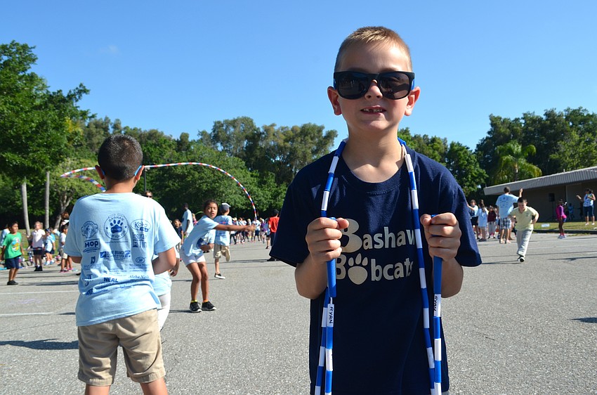 Jonah Adams stays cool with sunglasses and his jump rope nearby.