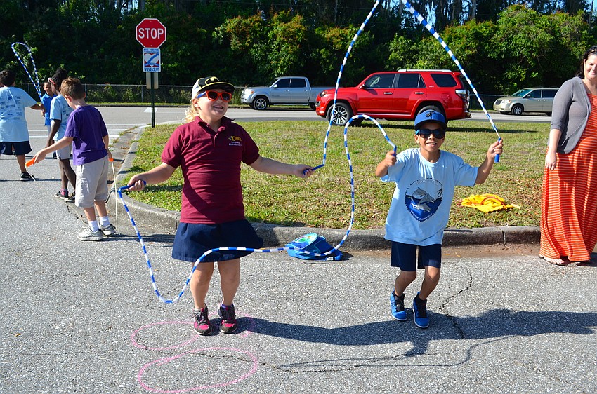 Nine-year-olds Mckenzie Goodman and Bryan Ocana jump rope as fast as they can.