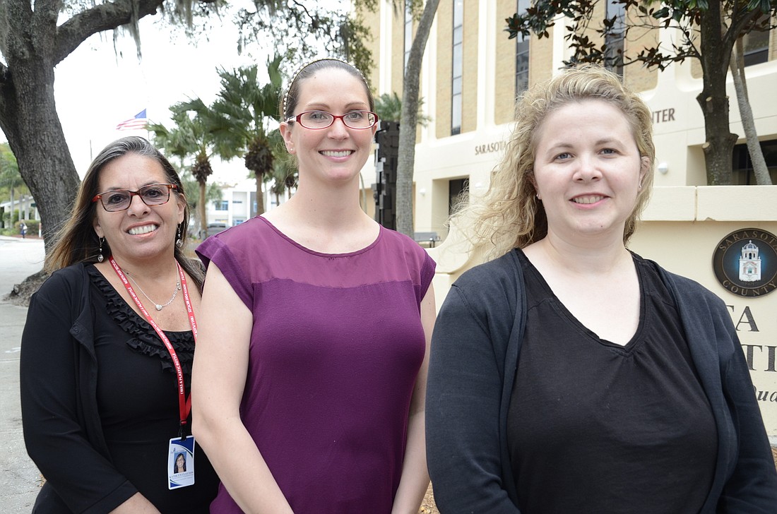 Kathlyn Clayton, Miranda Lansdale and Jane Grogg make up a three-person team that tackles neighborhood outreach, education and grant processes.