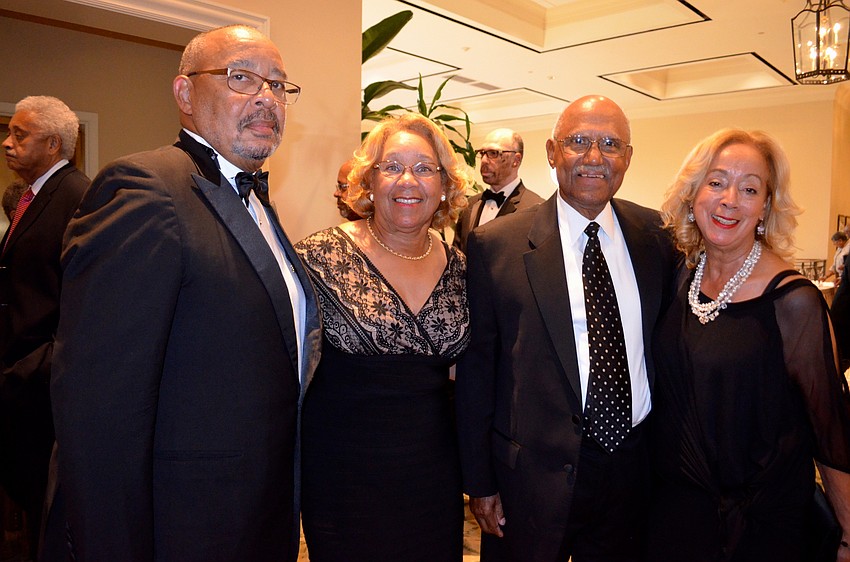 Friends Donald and Debbie Reaves, and Bill and Ronnie Lytle show support for the Sarasota chapter of the Sigma Pi Phi fraternity.