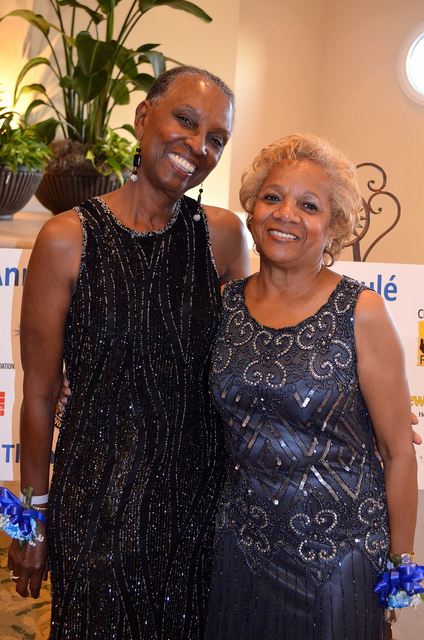 Longtime friends Constance Anderson and Dorothy Green show off their matching smiles and formalwear.