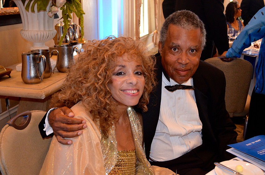 Roberta Calhoun-Morton and her husband, Allen Mourton, save seats at their table for their fraternity friends.