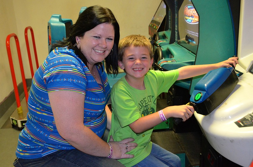 Kari and Blayne Jones try out a jet skiing game.