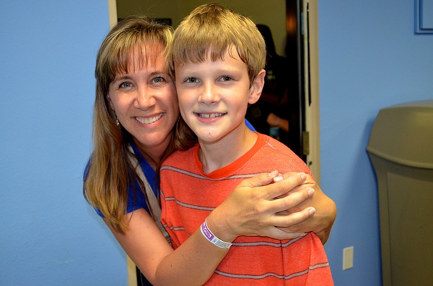 Traci and Jaxon Kundrat spend their Friday night playing arcade games and ice skating.