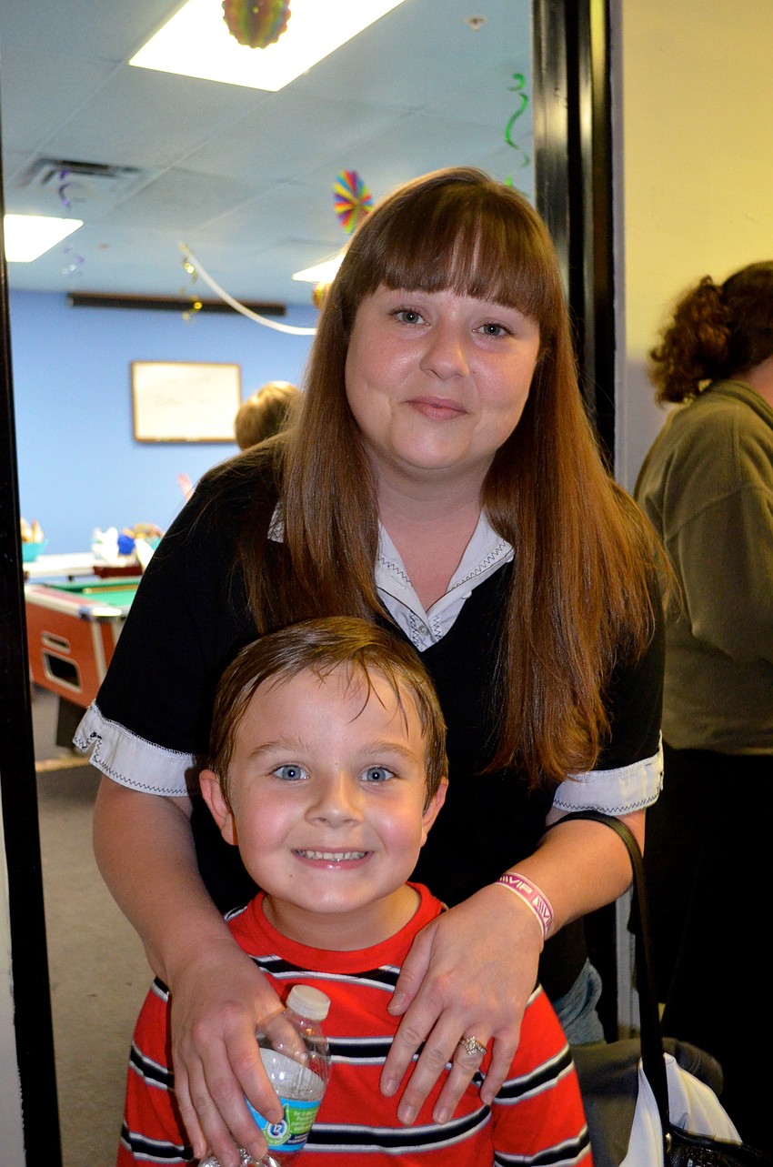 Brooke Temple steals her son, Andrew, away from a game for a quick photo.