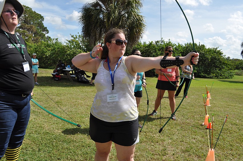 Crista McGraw hits the target in her first ever archery attempt.