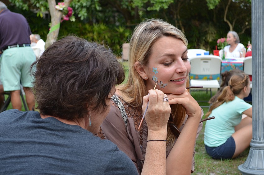 Emily Shaw has her face painted.