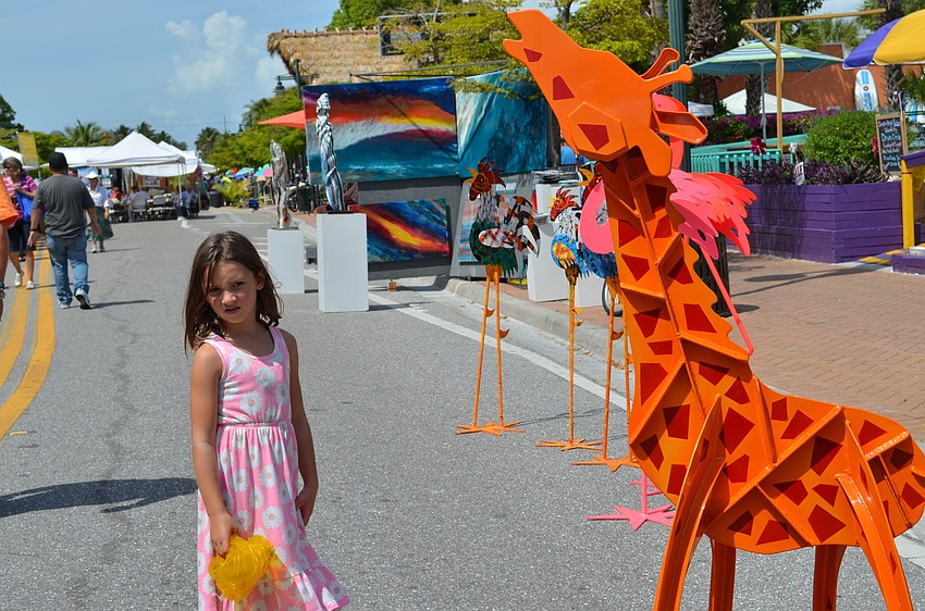 Eleanor Baldwin checks out the giraffe installation by Fredrick Prescott.