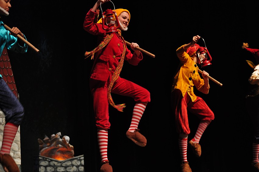 Alaina Kimsey as Happy and  Abbey Walsh, as Sneezy, dance joyfully.