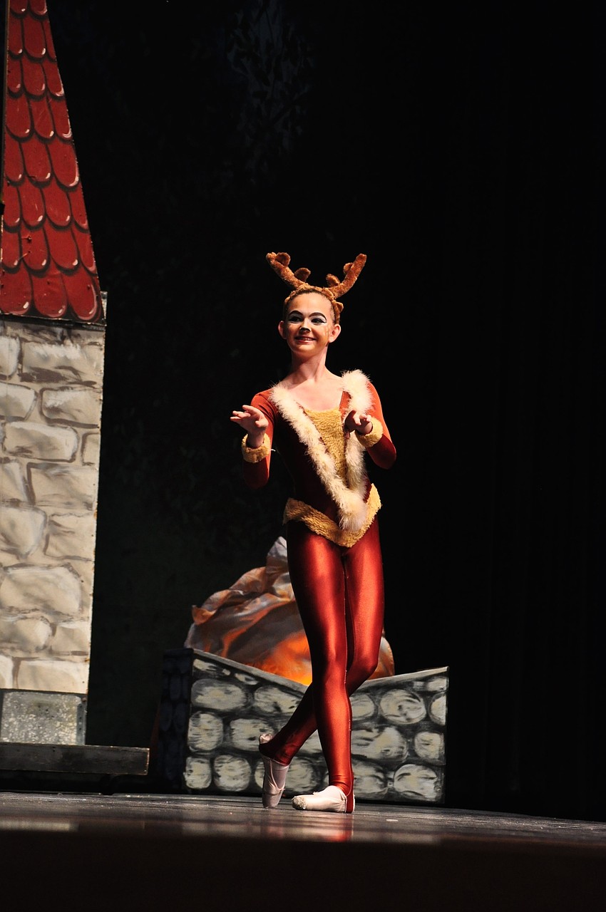 Grace Schlotthauer portrays a deer.