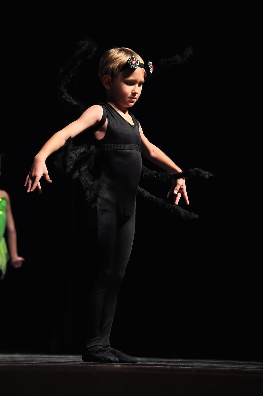 Tony Tiutyama is the lone spider amongst a group of insects.