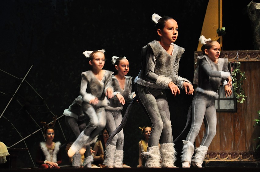 Sophia Sena, a cat, dances for Snow White.